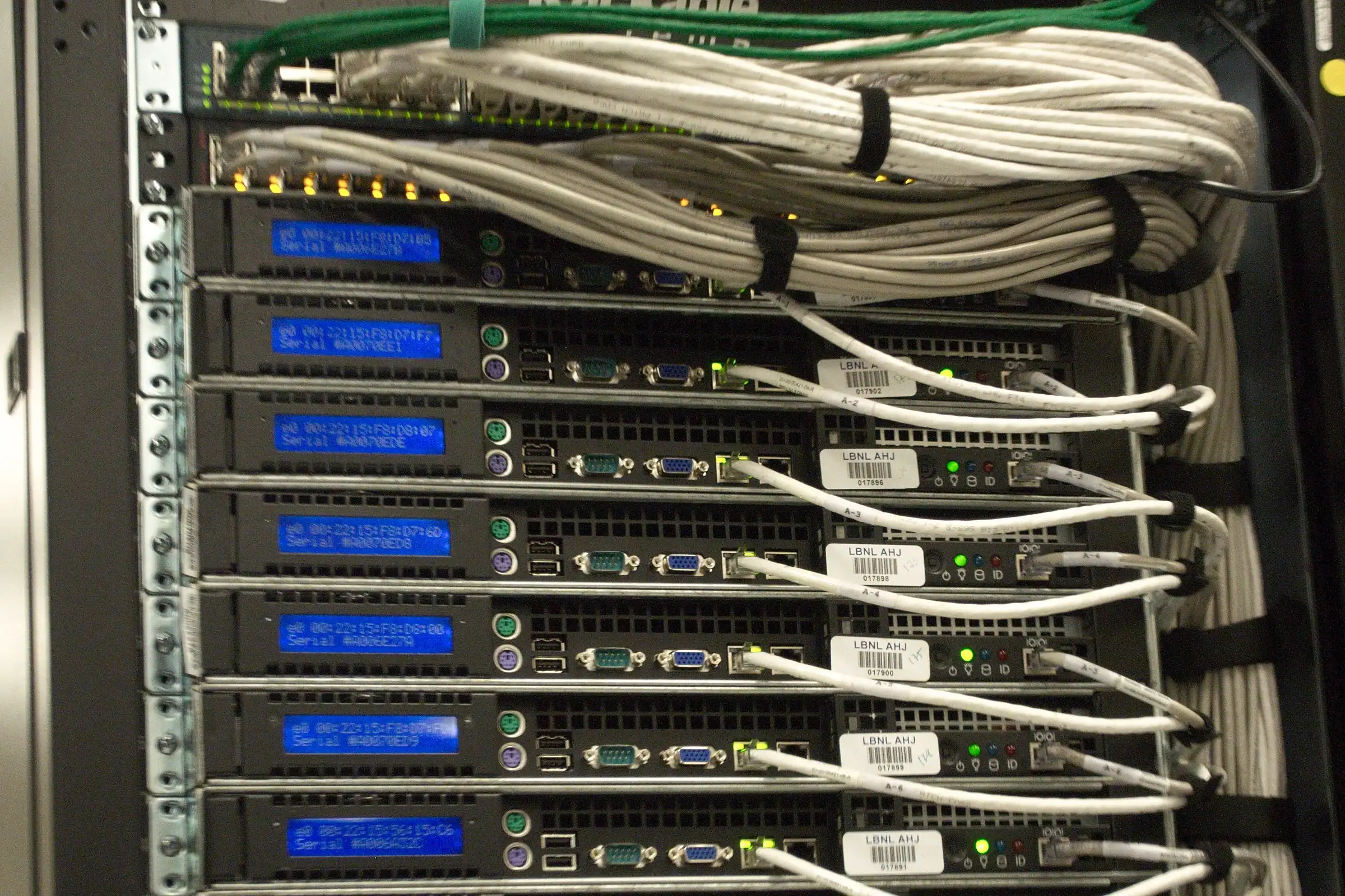 A rack of servers with blue status lights