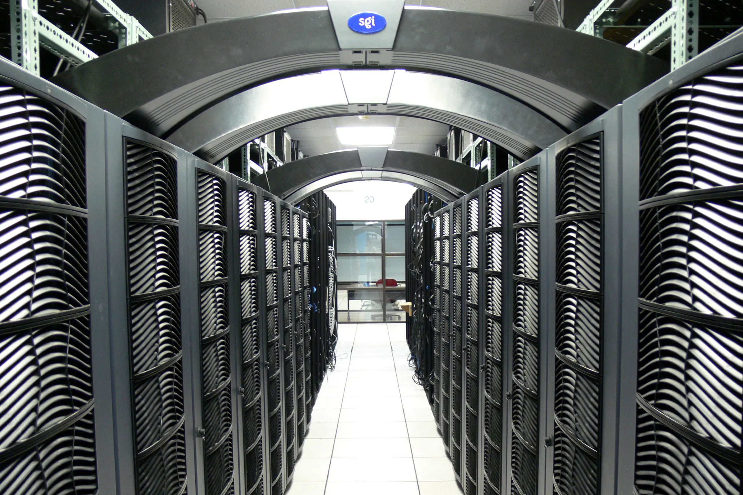 An aisle of server racks in a data centre